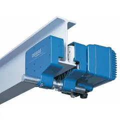 Motorized trolley for hoists with a maximum hoist load capacity of 2,420 lb. Features a tapered design and cast aluminum construction. Operates on 220/480V AC power with travel speeds of 20/80 fpm. Used to move hoists along beams in industrial settings such as manufacturing plants and warehouses.