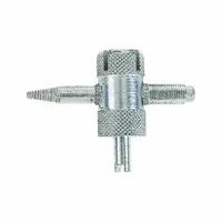 Steel four-way tool for tire valve maintenance. Includes core remover and thread repair for core and cap threads. Overall length 2 in, width 3/4 in. Used for removing and installing large-bore valve cores and restoring threads on valve stems