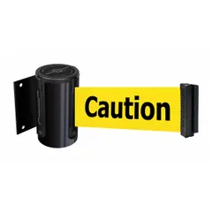 This wall-mount retractable belt barrier features a 7 1/2 ft yellow belt with black caution messaging and a black frame. Designed for fixed mounting, it is used for crowd control and pedestrian guidance in industrial and commercial settings.