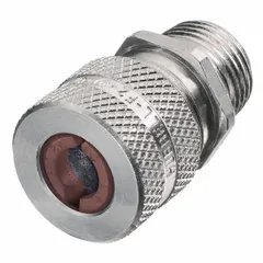 Straight metallic cable grip with aluminum body and silver finish. Features 1 in MNPT box connection, accommodates cord diameters 0.50 to 0.63 in, and includes a brown color-coded grommet. Rated IP66 and Class I, Division 2 for hazardous locations. Overall length 2 5/16 in. Used to secure and seal electrical cables entering enclosures in industrial environments.
