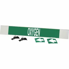 Green fiberglass carrier-mounted pipe marker with white 'Oxygen' legend and directional arrows. Designed for pipes with an outside diameter of 8 inches and larger. Includes strapping for installation. Suitable for identifying oxygen lines in industrial piping systems.