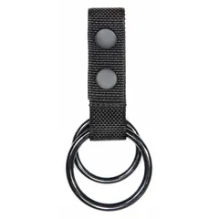 This duty equipment pouch is constructed from black nylon ballistic material. It measures 5 1/2 inches in length and 26 mm in width, with an open closure for quick access. Designed to carry a flashlight on a belt or vest, it is suitable for security and outdoor professionals requiring hands-free operation.