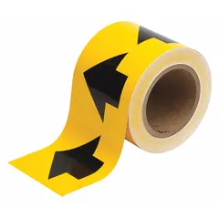 Yellow vinyl pipe marking tape with black directional flow arrows. Non-reflective, 4 inches wide on a 90-foot roll. Used for identifying pipe contents and indicating flow direction in industrial piping systems.