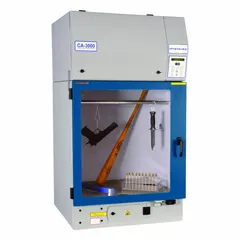 Cyanoacrylate fuming chamber with powder-coated aluminum housing and polypropylene base/stand. Includes work surface. Overall dimensions: 32 in depth, 29 in height. Used for controlled fuming processes in laboratory settings.