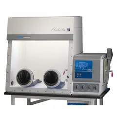 Stainless steel controlled atmosphere glove box with 2 ports and a pressure relief bubbler. Overall dimensions: 34 3/8 in width, 5 1/4 ft length, 45 3/4 in height. Used for handling oxygen- or moisture-sensitive materials in laboratory environments.