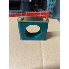 Steel clamp with polypropylene cushion for securing a single tubing or piping line. The ribbed bore enhances grip and dampens vibration, reducing noise and wear in industrial fluid and pneumatic systems.