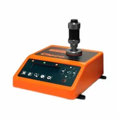 Bench-mount electronic torque tester for verifying and calibrating torque wrenches and tools. Displays measurements in foot-pounds and newton-meters. Used in industrial assembly, automotive, and manufacturing settings to ensure fasteners are tightened to specification for quality control and safety compliance.