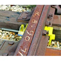Switch point lock designed for use by repair crews and track maintenance personnel. Features a 3-point handle style for secure grip and operation. Used to secure railroad switch points during maintenance work.