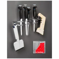 Wall-mounted pipette holder made of clear PETG. Overall height 2 1/4 in, overall length 3 5/8 in. Accommodates pipette hanger and pipette aid for organized storage in laboratory settings.