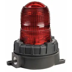 Red strobe light for hazardous locations, operating at 24V DC. Features a red lens, 8 3/16 in overall height, and 5 9/16 in overall diameter. Designed for ceiling mounting. Suitable for visual signaling in industrial environments where flammable gases or vapors may be present.