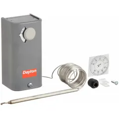 Steel-enclosed line-voltage thermostat with SPDT switch action (open/close on rise). Adjustable temperature differential from 3° to 12°F. Control range -30° to 90°F. Operates at 120V/240V/277V AC. Includes 8 ft capillary with 5 in x 1/4 in bulb. Used for basic indoor temperature regulation in commercial or industrial spaces.