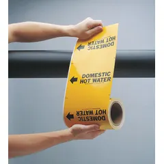 Yellow adhesive pipe markers with black legend text reading 'Boiler Feed Water' and flow-direction arrows. Each roll contains 30 markers designed for pipe outer diameters from 2-1/2 to 6 inches. Used to identify boiler feed water lines in industrial piping systems, aiding in quick identification and tracing during operation or maintenance.