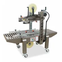 Top-and-bottom case sealing machine for tape up to 2 inches wide and rolls up to 16 inches in diameter. Conveyor height adjustable from 22 to 32 inches. Belts on top and bottom transport boxes through the sealing process