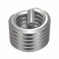 18-8 stainless steel helical insert with dry film lubricant finish. Features a 1/4"-28 fine thread, right-hand direction, and tensile strength of 200,000 to 250,000 psi. Requires STI tap size 1/4"-28. Used to repair or reinforce threads in metal substrates, providing locking action to resist vibration loosening