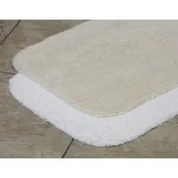 This bathroom rug is made of white cotton with a cotton duck backing, weighing 28 oz. It measures 36 inches in length and 24 inches in width. The rug provides a soft, absorbent surface for bathroom floors, helping to reduce slipping and absorb moisture. Suitable for residential or light commercial restroom areas