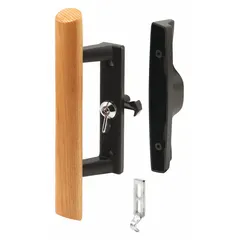 This recessed handle for sliding doors measures 9 inches in height and 2 inches in width. It is designed to secure sliding doors in commercial or industrial settings, providing a flush profile on the door surface.