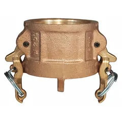 This dust cap seals the end of a 4-inch cam-and-groove coupling when not in use, protecting internal components from dirt, debris, and moisture. It features a forged brass body and a nitrile gasket, with a maximum working pressure of 100 psi at 70°F and an overall length of 3 21/64 inches.
