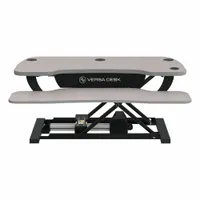 This electronic standing desk converter from VERSADESK features a gray wood desktop measuring 36 inches wide by 24 inches deep. It provides a sit-stand workstation solution, allowing users to alternate between sitting and standing positions during work