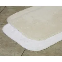 This bathroom rug is made of white cotton with a cotton duck backing, weighing 19 oz. It measures 34 inches in length and 21 inches in width. Suitable for use in residential or light commercial bathrooms to provide a soft, absorbent surface
