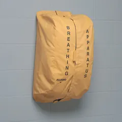 This vinyl storage bag is designed to protect respirators and SCBA equipment from dust and damage. The black/yellow cover includes silk screening identification for clear labeling. Suitable for industrial safety environments where organized storage of respiratory protection is required.