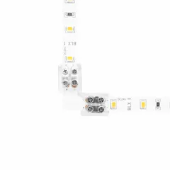 This 90° corner connector joins two tape light segments at a right angle for continuous runs in cove, under-cabinet, or architectural lighting. It features screw terminals for secure tape-to-tape connections and accepts wire gauges from 20 AWG to 16 AWG. The connector measures 1.3 inches in length.