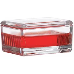 Glass staining dish with cover for manual slide staining procedures. Holds up to 20 slides. Dimensions: 75 mm height, 55 mm width, 35 mm depth. Resistant to chemical corrosion from stains and solvents.