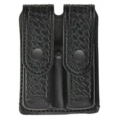 This duty equipment pouch is constructed from black synthetic leather with a basket weave finish. It measures 5 3/4 inches by 1 5/16 inches and is designed to hold a magazine for quick access. Commonly used by law enforcement, security, and military personnel for belt or duty rig storage.