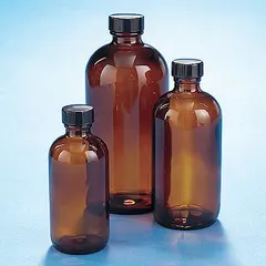 This 250 mL amber narrow mouth round glass bottle is made of Type III soda lime glass and features a 24-400 mm neck finish. It comes with an attached phenolic cap and a PolyCone liner for a secure seal. The amber color protects light-sensitive contents from UV degradation, making it suitable for general laboratory storage of chemicals and samples.