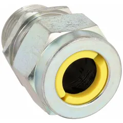 Straight metallic cable grip with steel body and 1/2 in MNPT box connection. Accommodates cord diameters from 0.63 in to 0.75 in. Features a yellow color-coded grommet and is rated IP66 for liquid-tight sealing. Suitable for use in hazardous locations classified as Class II, Division 1 & 2, providing strain relief and environmental protection for electrical cords entering enclosures.
