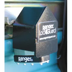 Steel padlock guard with integrated lock in black finish. Guard length 2-1/2 inches, guard width 4 inches. Designed to protect padlocks from tampering and weather in industrial applications such as gates, lockers, cabinets, and equipment enclosures.