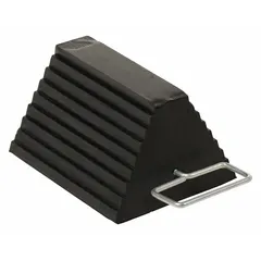 Black rubber wheel chock with extended handle, measuring 9 1/4 in length, 8 in width, and 6 in height. Used to prevent parked vehicles, trailers, or industrial equipment from rolling on concrete or asphalt surfaces.