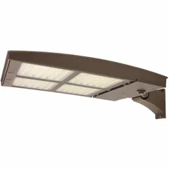 LED street and parking lot light fixture with arm mount, delivering 39,000 to 40,500 lumens at 300 watts. Features Type III distribution for area and roadway illumination. Available in 3000K, 4000K, or 5000K CCT. Bronze finish housing.