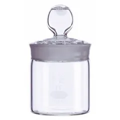 This KIMBLE weighing bottle is made of colorless glass with a narrow mouth and includes a plug closure. It measures 72 mm in height and meets ASTM/USP standards. Used in analytical laboratories for precise weighing of solid samples, powders, or hygroscopic materials, the narrow mouth and plug closure minimize moisture absorption and contamination.