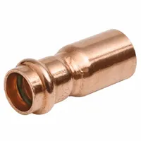 This NIBCO Press System reducer fitting connects a 4-inch CTS copper line to a 2-inch CTS line. It features a press-fit connection on one end and a female threaded (FTG) connection on the other. Made of copper or bronze, the press-fit design enables fast installation without soldering. Suitable for use in water supply lines