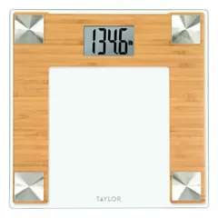 This TAYLOR digital bathroom scale displays weight in pounds with a readability of 0.2 lb. It features an integrated indicator and a 12 1/4 in wide weighing surface suitable for home or light commercial use. The scale is not IP rated and is intended for dry indoor environments.