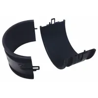 Sliding-jaw fitting made of black Polyamide 6, designed for use with 1-1/4 in corrugated tubing. Functions as a spring and spring holder in continuous-flex cable management systems, providing strain relief and guidance in dynamic applications