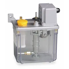 This TRICO oil-dispensing machine-mount lubrication system delivers a maximum output volume of 36 cc through a 5/16 in port to a single feed point. It is designed for automatic lubrication of industrial machinery, providing consistent oil supply to reduce wear and extend equipment life.