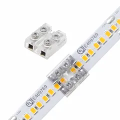 Terminal block connector for tape-to-tape or tape-to-terminal block connections in linear lighting systems. Accepts wire gauges from 20 AWG to 16 AWG. Suitable for low-voltage LED installations requiring secure, solderless connections.