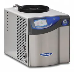 This benchtop freeze dryer from LABCONCO operates at -50°C and has a 2.5 L dry ice holding capacity. It includes a 3-wire electrical cord with plug. The drying chamber and purge valve are not included. Suitable for lyophilizing heat-sensitive materials in laboratory settings.