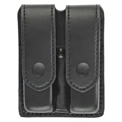 This duty equipment pouch is constructed from black synthetic leather with a plain finish. It measures 5 3/4 inches by 1 5/16 inches and secures with a snap closure. Suitable for carrying spare magazines or similar items on a belt or duty rig.