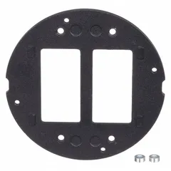 Round electrical floor box cover made of cast aluminum with a smooth black finish. Designed to provide a flush, durable surface for floor boxes in commercial and industrial environments, protecting wiring while maintaining a low-profile appearance.