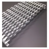 This steel channel features a serrated surface for slip resistance. It is used as a stair tread or structural channel component in industrial environments such as factories, warehouses, and processing plants