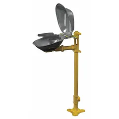 This floor-mount eyewash station provides eyes and face coverage for flushing contaminants. It features a covered stainless steel bowl and is activated by a push plate. Designed for permanent installation in industrial settings where immediate eyewash access is required.