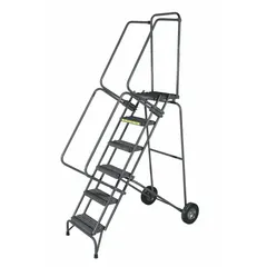 This steel tilt-and-roll ladder provides a mobile access platform for elevated work areas. It features double handrails and a gray finish. The unit is supplied unassembled and has no rear chain or locking mechanism. Typical applications include warehouse stock picking, maintenance tasks, and industrial servicing.
