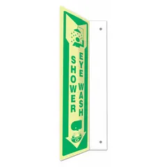 PETG safety sign with L-Shape Projection design for marking shower and eye wash stations. Measures 18 in x 4 in nominal size, features mounting holes for installation, is not retroreflective, and glows in the dark for visibility in low-light conditions.