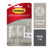 Nickel-finished adhesive-backed hook for indoor use, holding lightweight items up to 1 lb. Each hook has one point and an overall height of 2 19/32 inches. Suitable for organizing keys, small tools, or decorations on walls without damage