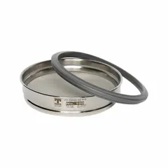 This air jet test sieve features a stainless steel frame and screen mesh with a #635 US Standard Screen Size. It has an outside diameter of 7 7/8 inches and a height of 1 5/8 inches. Used for fine particle size analysis of dry powders in laboratory settings.