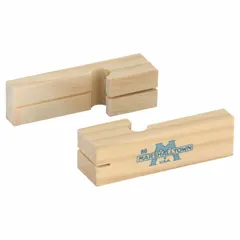 This masonry line holder is made of wood with a 4-inch overall length. It is used to hold and guide chalk lines or mason lines during brick, block, or stone laying, helping to ensure straight and level courses in wall construction.