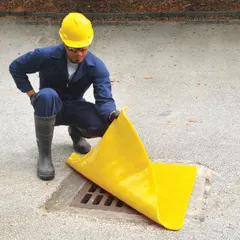This self-sealing drain cover seal is made of yellow polyurethane with a 3/8 in thickness. It measures 24 in L x 24 in W and fits a maximum drain size of 18 in L x 18 in W. Used to cover industrial drain openings for containment and safety.