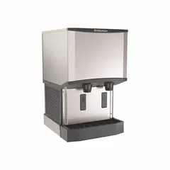 This combination ice machine and dispenser produces 500 lb of nugget ice per day. Water-cooled operation and an infrared sensor enable automatic, touchless dispensing. Dimensions: 35 in H x 21 1/4 in W x 24 3/8 in D. Suitable for commercial kitchens, cafeterias, and healthcare facilities.